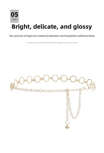 Close-up of golden metal waist chain with hammered texture round links and bead charms