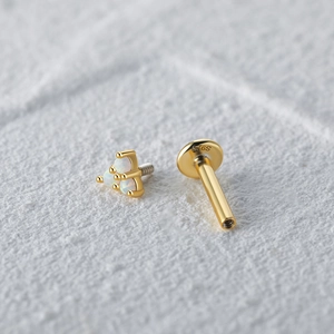 Macro view of gold plated S925 silver thread labret with three opal stone triangle