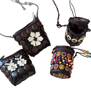 Handmade bohemian coconut shell crossbody bag with ethnic floral patterns and wood beads