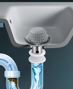 Vista trasversale del tappo in silicone per lavandino che filtra i capelli nello scarico