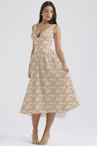 Detail of V-neck floral midi dress with purple and white print on yellow fabric
