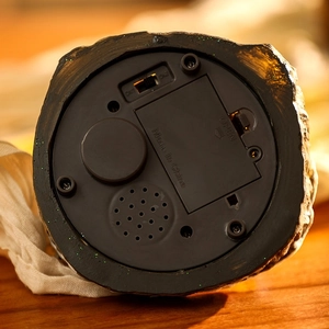 Detail of the bottom battery compartment and 3-way toggle switch for the musical snow house