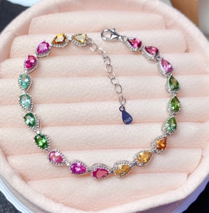 Close-up of S925 silver stamp on multi-color teardrop tourmaline charm bracelet
