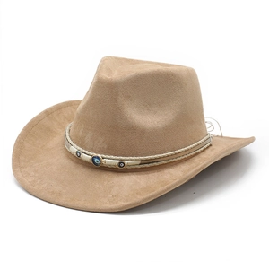 Detail of tan suede cowboy hat with woven band and blue evil eye charms