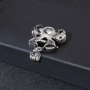 Polished stainless steel skull pendant for men with S925 hallmark on black background