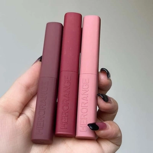 Three matte slim tube lipsticks in deep red, brick red and pink shades by Herorange