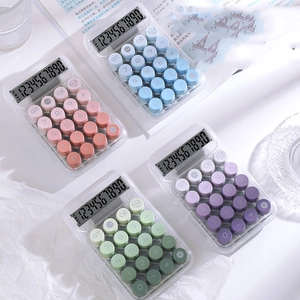 Detailed close-up of transparent candy-colored calculators with round chocolate keys