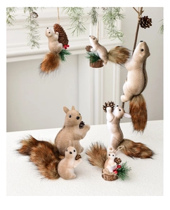Detail of plush squirrel ornaments with bushy brown tails and pine cone accents