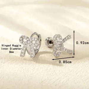 Silver bow earrings set with white cubic zirconia featuring 8mm hoop and stud designs