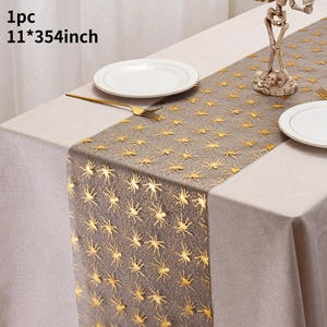 Halloween table runner featuring gold spider and web patterns on grey mesh fabric