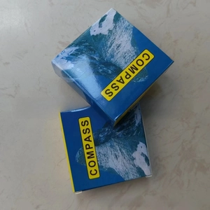Detail view of the mountain-themed gift box for the outdoor hiking adventure compass