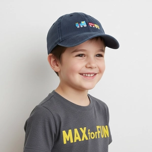Detail of navy cotton baseball cap featuring colorful train embroidery for kids