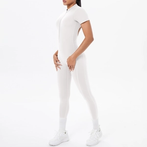 Detailed side view of white short-sleeve athletic jumpsuit with front zipper and stand collar