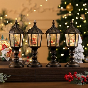 Antique bronze Christmas lanterns with snow scenes and warm glowing LED lights