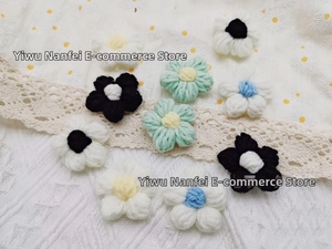 Detailed close-up of handmade crochet yarn flowers for DIY hair accessories and decor