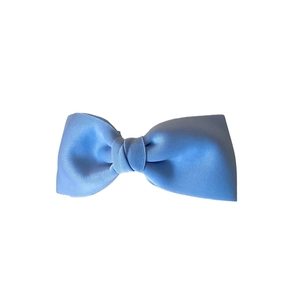 Large light blue fabric bow hair clip for women with minimalist and elegant design