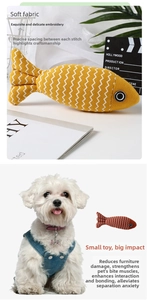 Close-up of linen fish cat toys with detailed embroidery and catnip-filled fabric