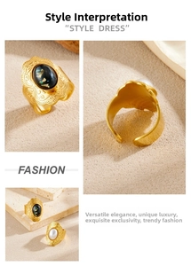 Detail of vintage gold-plated rings featuring inlaid pearl and lapis-style stones
