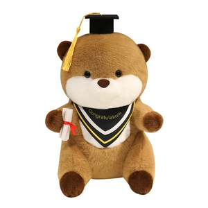 Cute brown plush otter toy wearing a black graduation cap and holding a diploma