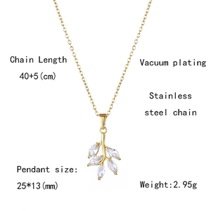 Detail view of 18K gold leaf pendant with cubic zirconia on stainless steel chain