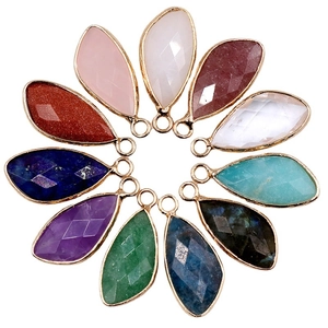 Faceted teardrop crystal pendants in colorful natural stones with gold plated edges
