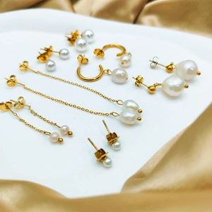 Collection of gold 14K plated stainless steel earrings with elegant white freshwater pearls