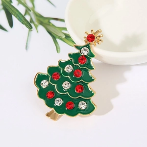 Detail of Christmas tree brooch with green enamel and multi-color rhinestones on gold alloy
