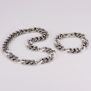 Detail of hip hop chain set featuring silver metal and white ceramic link texture