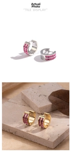 Detail of pink crystal double-row stud earrings in silver and gold finishes
