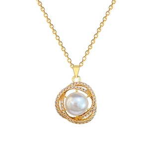 Elegant gold bird nest necklace with sparkling crystals and a white pearl pendant