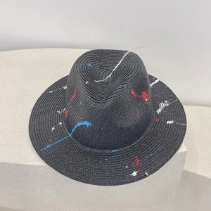 Handcrafted black straw fedora hat featuring colorful graffiti splash design for summer