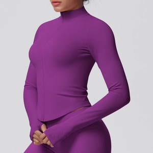 Close-up of slim-fit purple yoga jacket with stand collar and thumbhole cuff detail