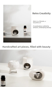 Detail of retro white ceramic incense burner with abstract face relief and glazed texture