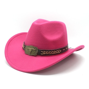 Detail of western cowboy hat with a pink felt texture and decorative bull buckle band