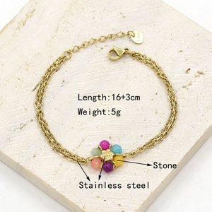 Detail view of colorful natural stone beads on a gold-plated stainless steel chain bracelet