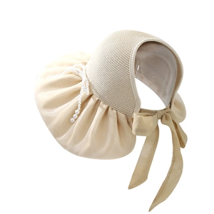 Women's foldable sun visor with wide straw brim, pearl bow, and open top for beach travel