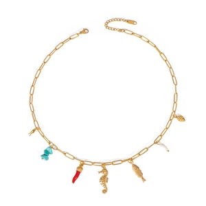 Detail of stainless steel gold chain necklace with turquoise, seahorse and shell charms