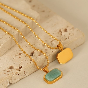 Titanium steel necklaces with emerald and gold rectangle pendants on gold rice chains