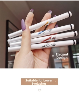 Hand holding four waterproof liquid eyeliners with colorful nib indicators and white tubes