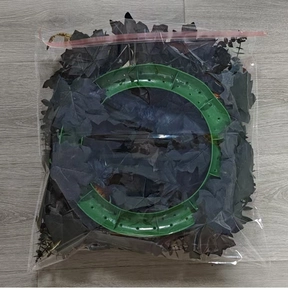 DIY Halloween wreath kit with black maple leaves and green frame in clear zipper bag