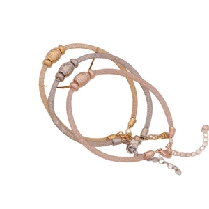 Three-piece stretch C-shape mesh bracelets in gold, silver, and rose gold with rhinestones