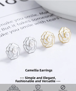 Detailed macro view of S925 sterling silver camellia studs with white pearls