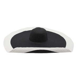 Oversized wide-brim woven straw sun hat with stylish black and white contrast design