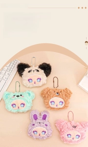 Close-up of colorful plush monster keychains with detailed embroidery and long faux fur