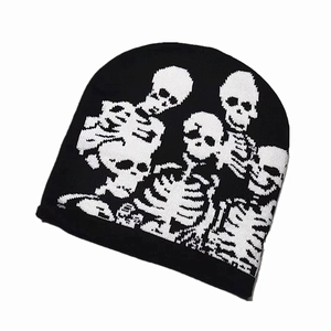 Winter black knit beanie with white jacquard skull pattern for hip-hop fashion style