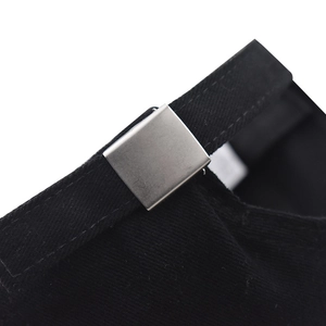 Detailed macro shot of the adjustable silver metal buckle on a black cotton baseball cap
