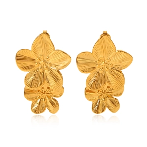 Close-up of golden double-layered five-petal flower earrings with professional reflection