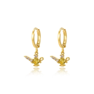 Detailed view of golden Genie lamp earrings featuring micro-set zircons and a yellow gemstone