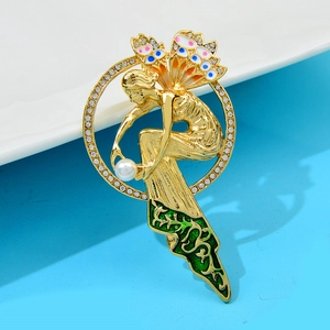 Vintage gold fairy brooch with colorful enamel wings and a pearl in a rhinestone circle