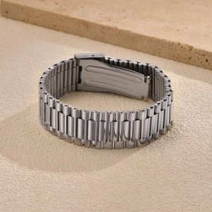 Detail of the stainless steel president-style watch strap with secure folding clasp